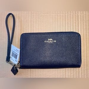 NWT. Dark Blue Coach Wristlet with Gold Hardware.